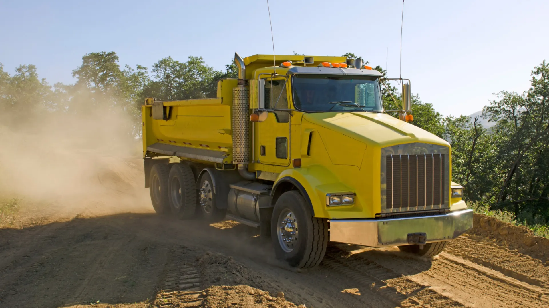 Dump truck moving along a haul route
